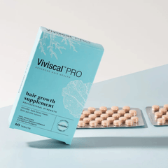 Viviscal Pro hair growth supplement packaging on a light blue background