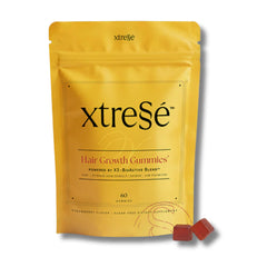 Xtressé strawberry hair growth gummies pouch with two gummy cubes