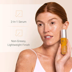 Woman holding Yon-Ka Elixir Vital 2-in-1 nourishing serum with non-greasy lightweight finish