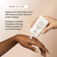Applying Yon-Ka Paris SPF 50 Mineral Fluid sunscreen to hand — water resistant 80 minutes