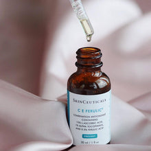 Load image into Gallery viewer, Dropper bottle of SkinCeuticals CE Ferulic Serum against a simple backdrop

